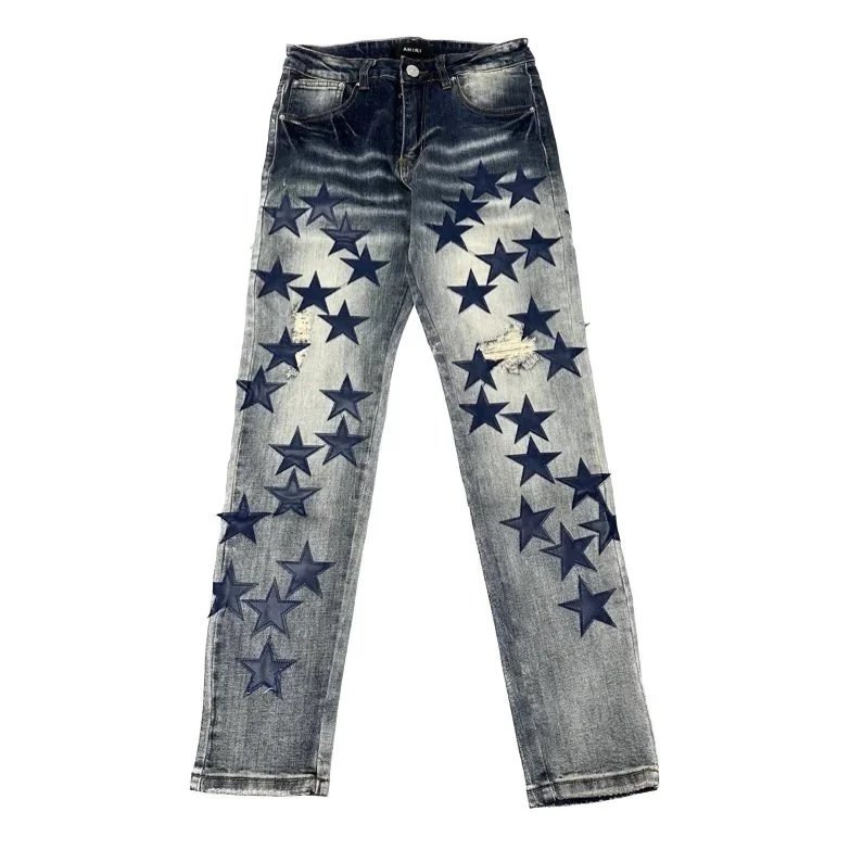 Amiri Star-Print Distressed Denim Jeans - Blue Fade